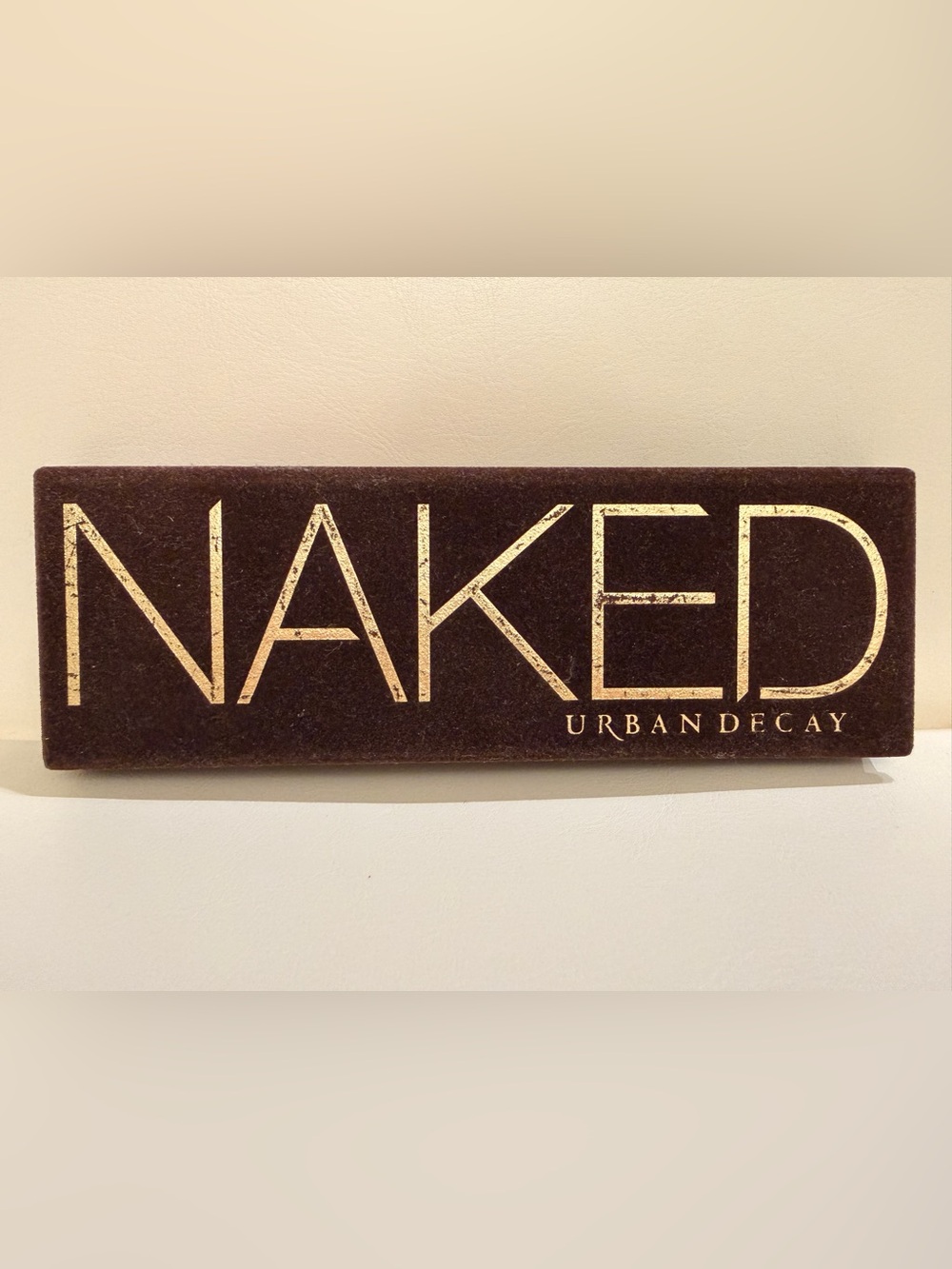 Urban Decay NAKED Wall Plaque in Brown and Gold